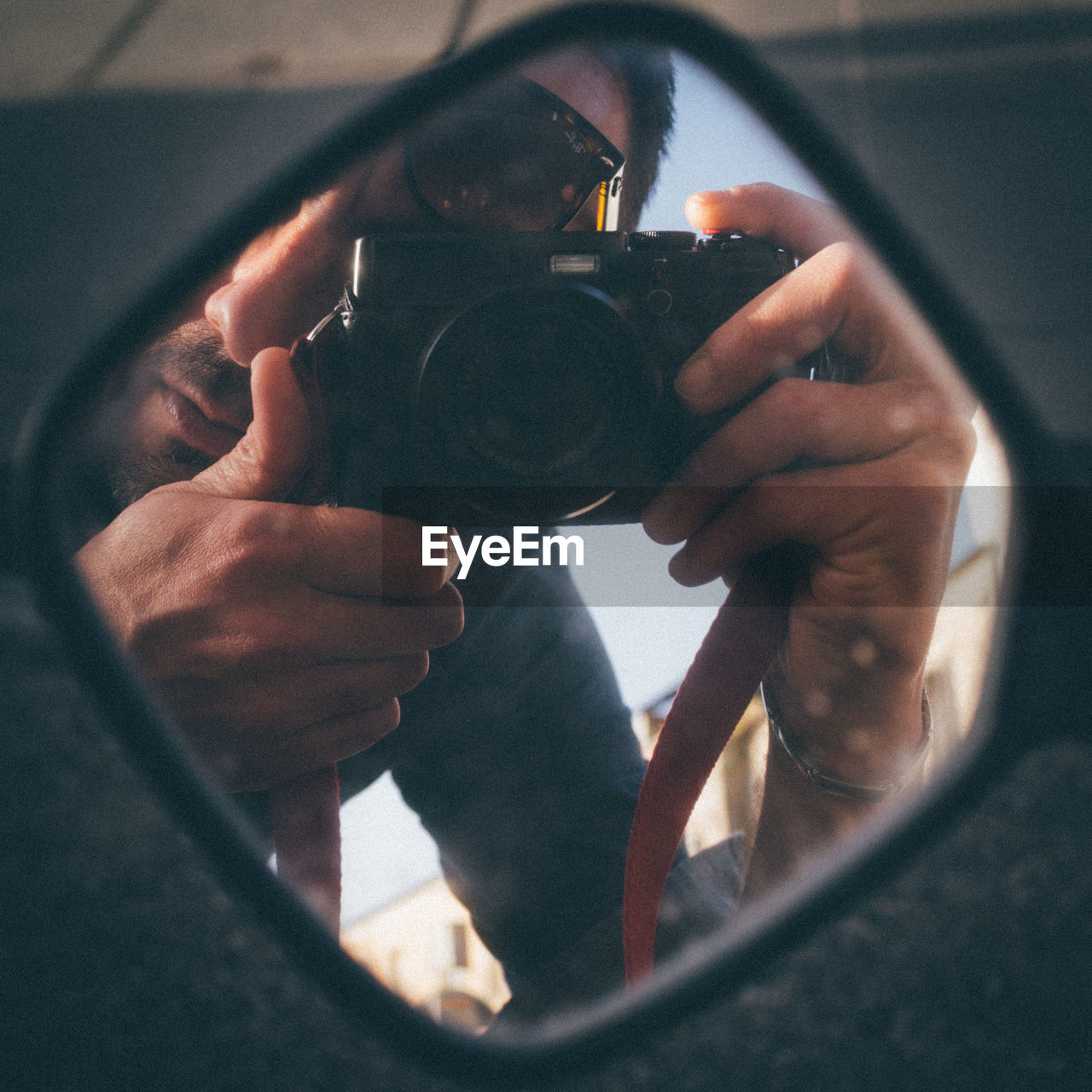 Man photographing through camera