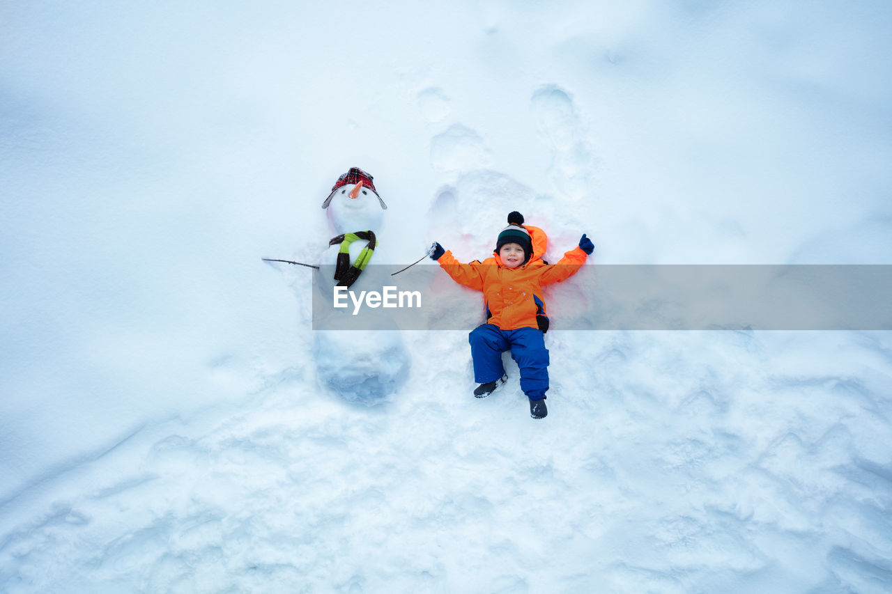 high angle view of man skiing on snow