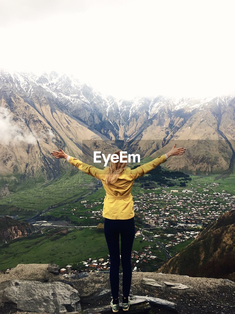 View of woman standing on mountain
