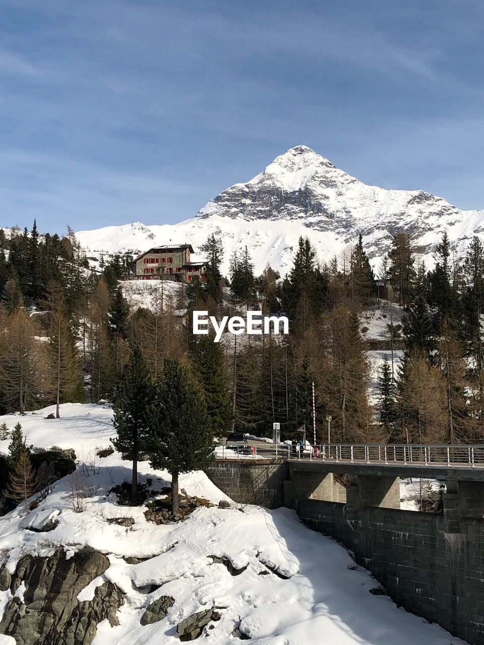 Scenic view of snow covered mountains against sky