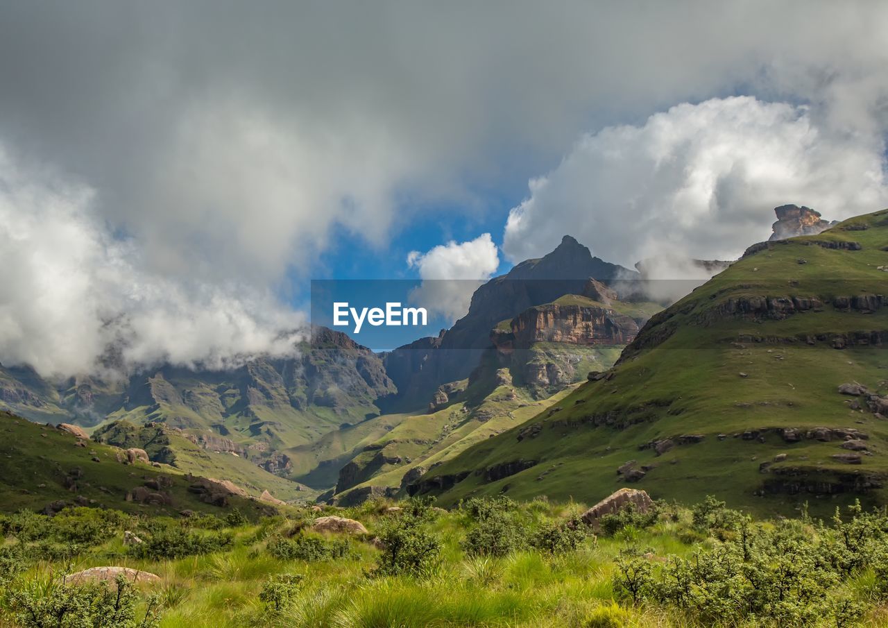 PANORAMIC VIEW OF MOUNTAINS AGAINST SKY