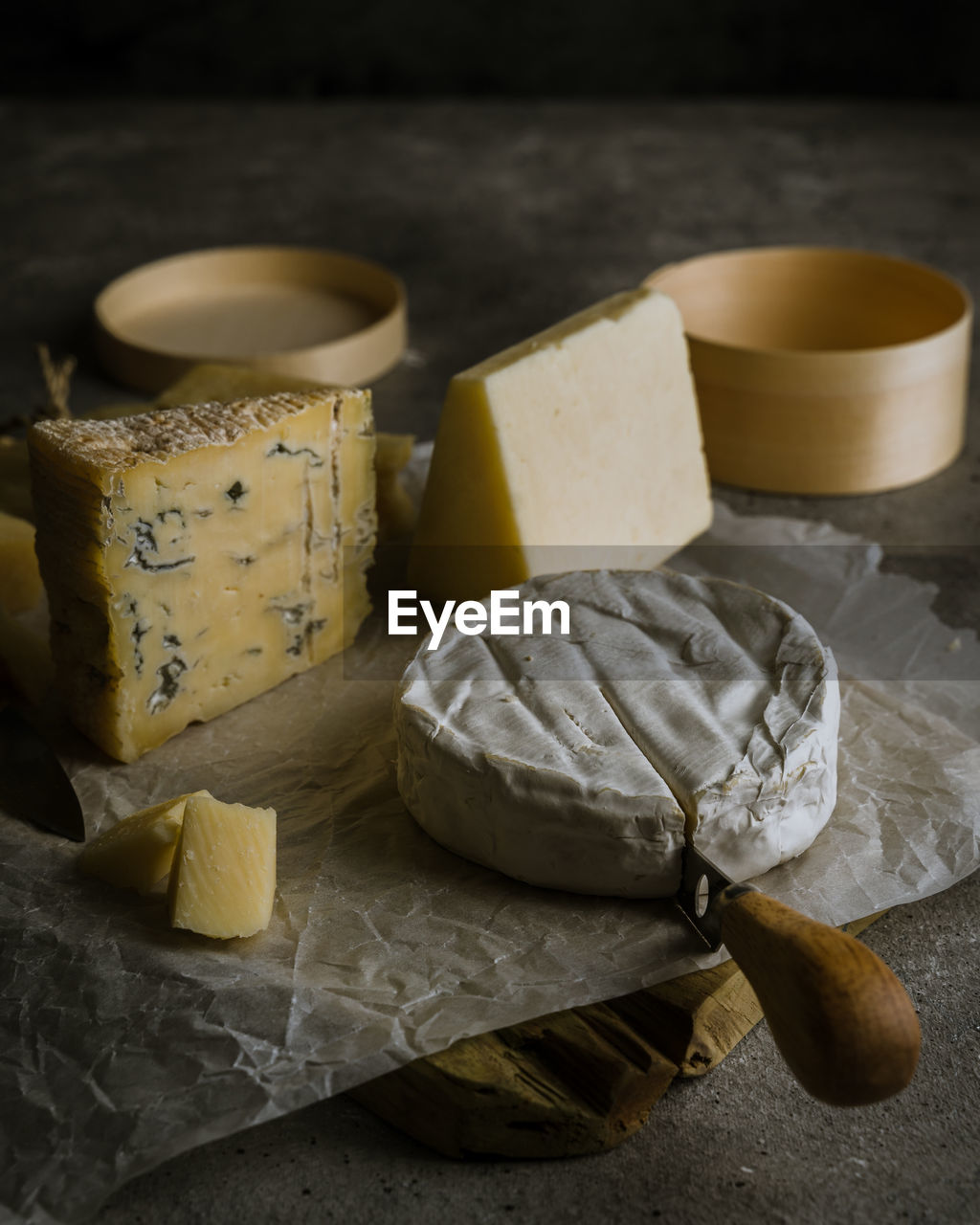 Variety of cheeses on dark background 