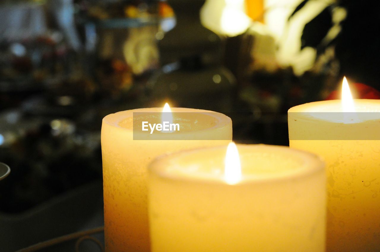 Close-up of illuminated candles at restaurant