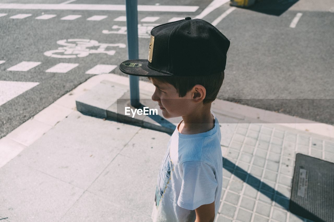 Boy standing on street