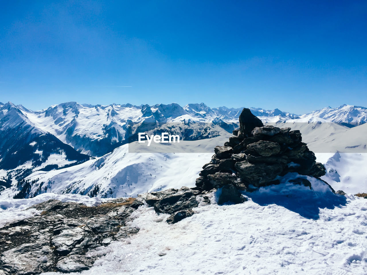 Scenic view of mountains against cloudy sky