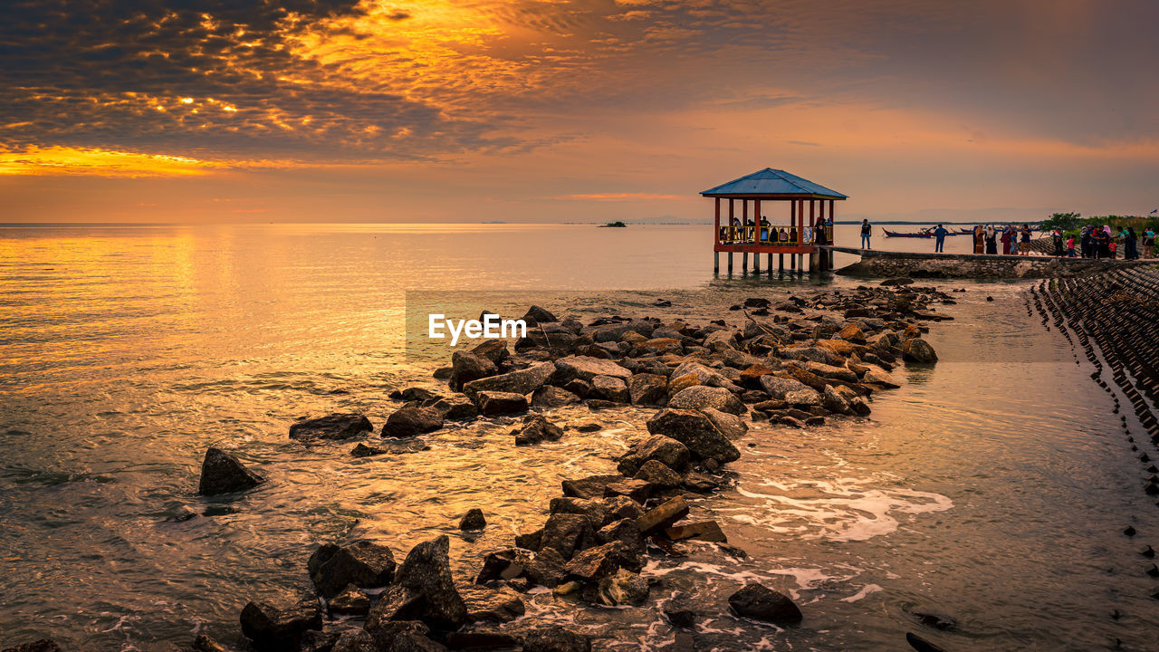 SCENIC VIEW OF SEA DURING SUNSET