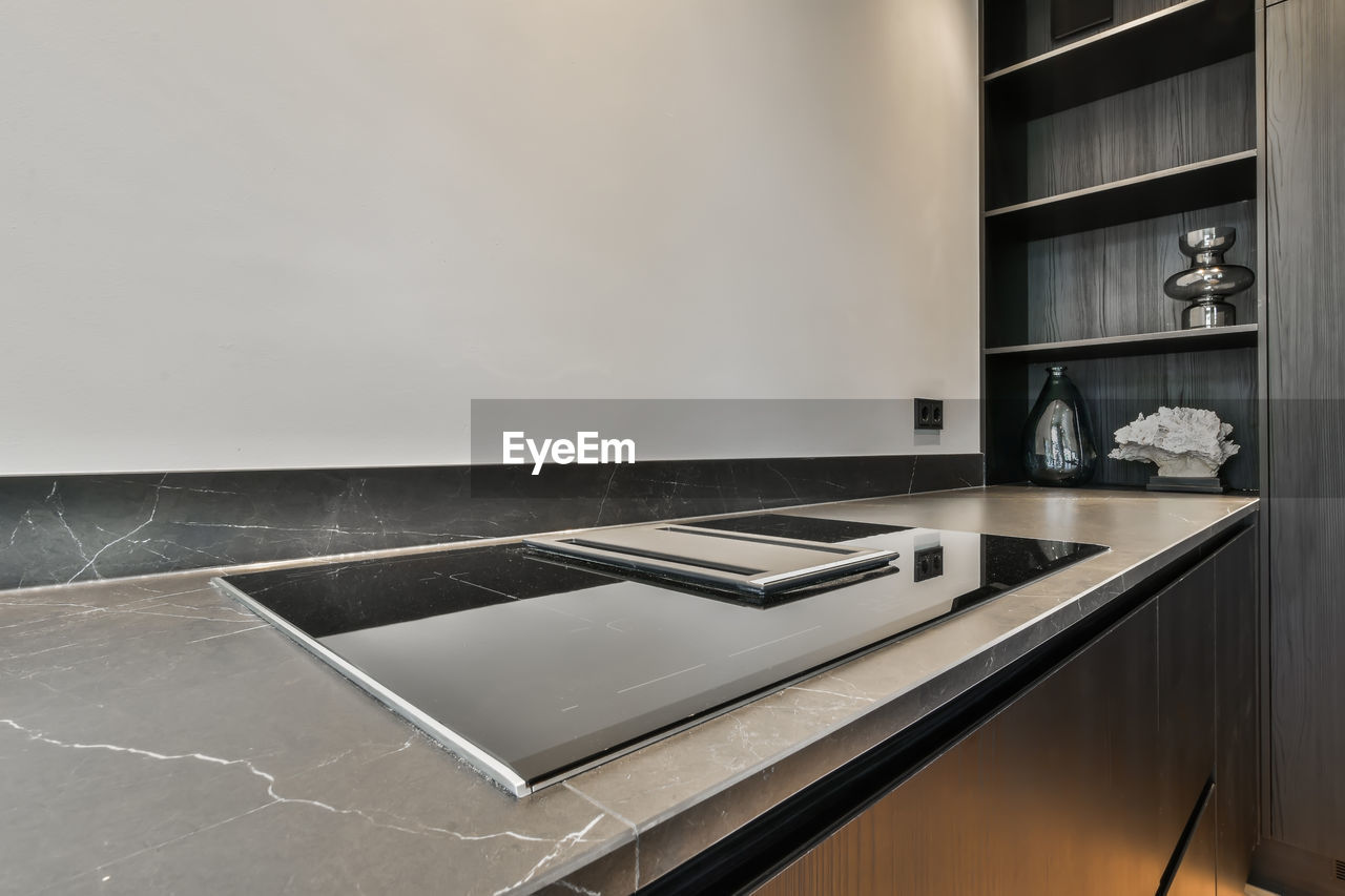 Glass-ceramic stove top in modern kitchen at home
