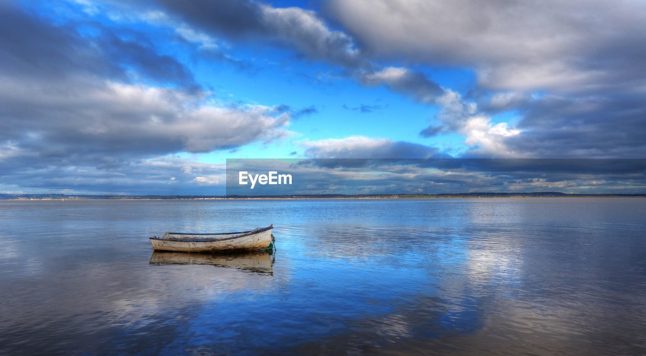 Boats in calm lake