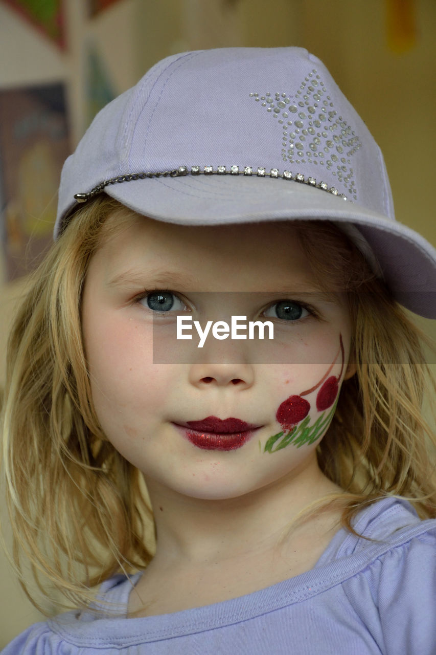 Close-up portrait of girl with face paint