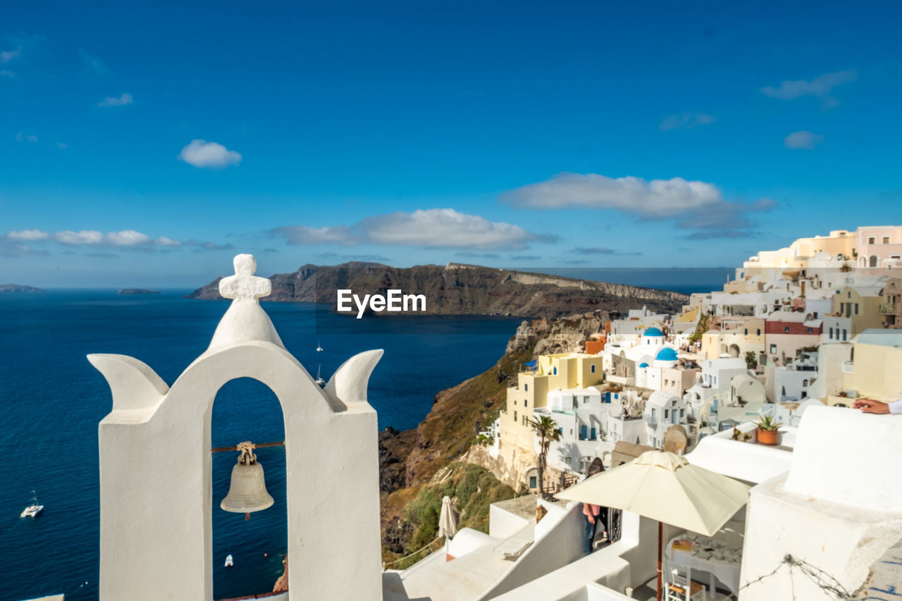 PANORAMIC VIEW OF BUILDINGS AND SEA AGAINST SKY