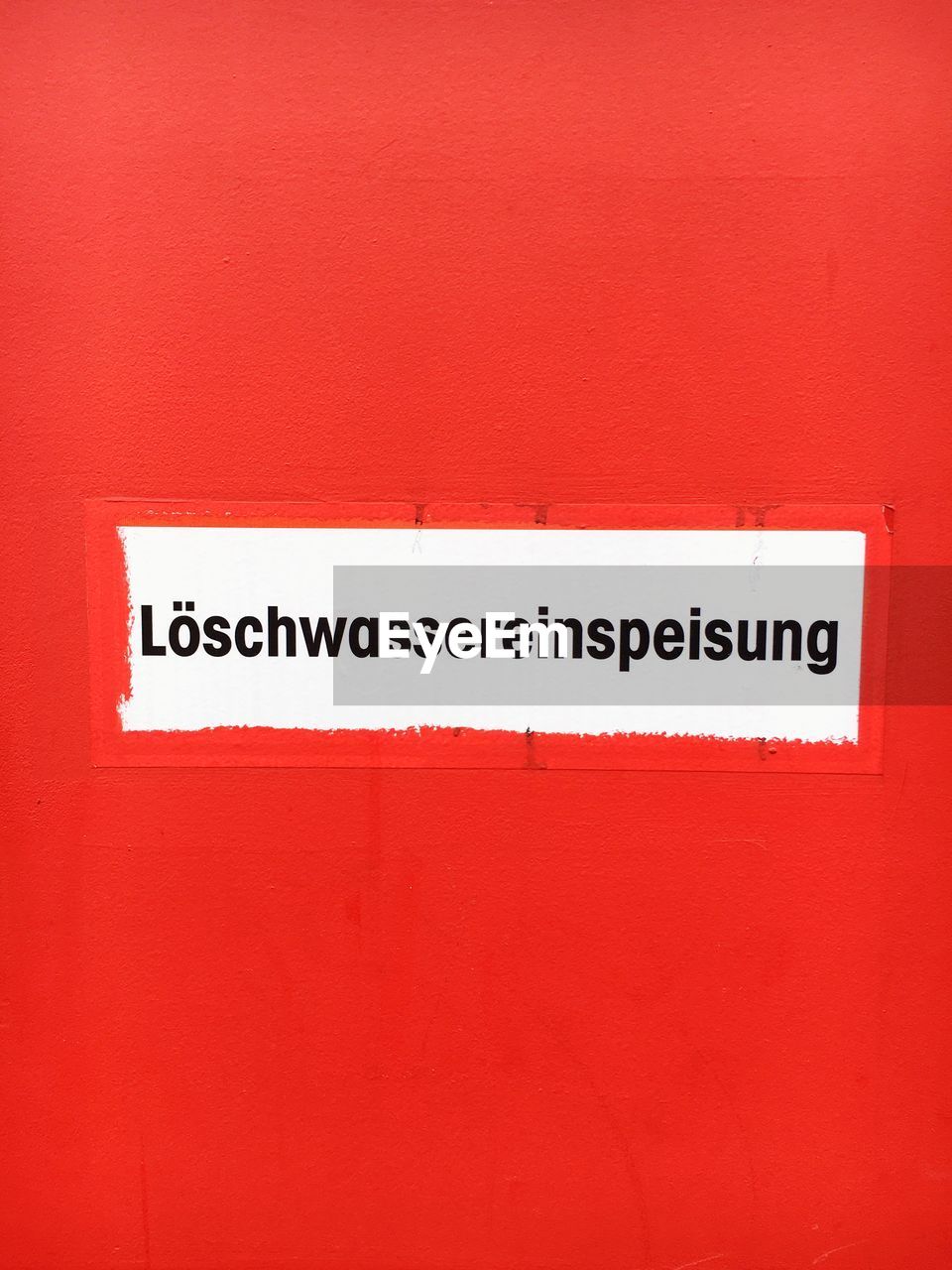 Information sign on red wall