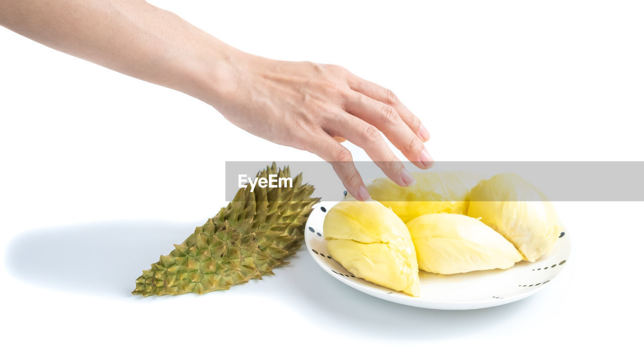 CROPPED IMAGE OF WOMAN HOLDING FRUIT