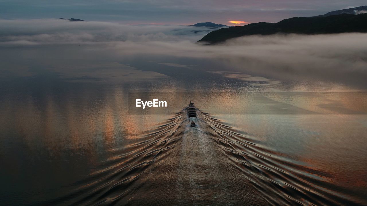 Scenic view of lake against sky during sunset