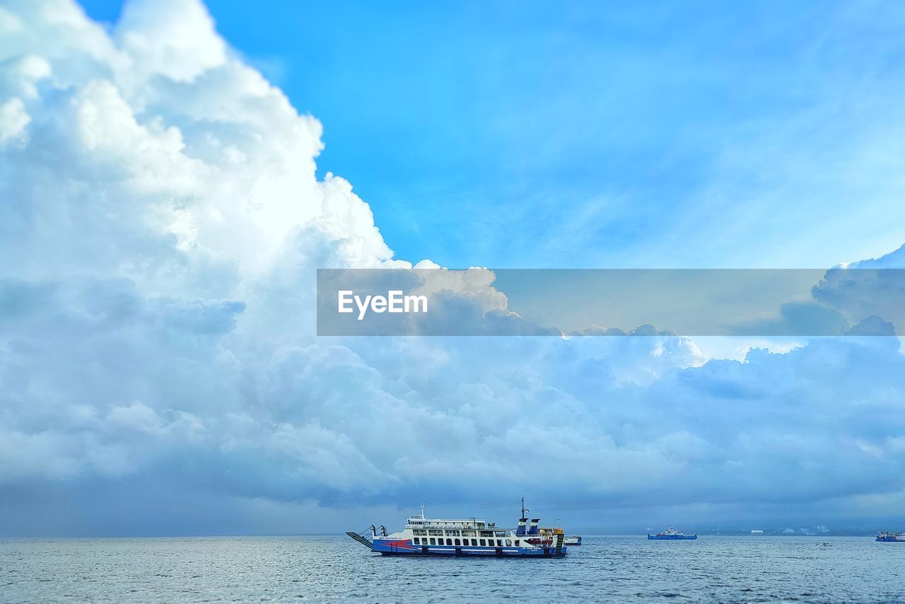 NAUTICAL VESSEL IN SEA AGAINST SKY