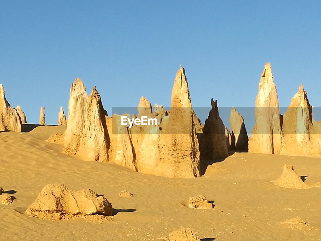 PANORAMIC VIEW OF DESERT AGAINST CLEAR SKY