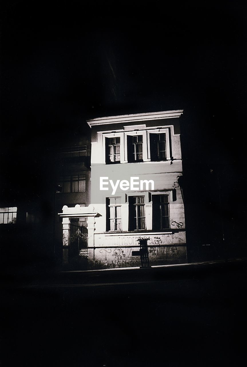 VIEW OF BUILDINGS AT NIGHT