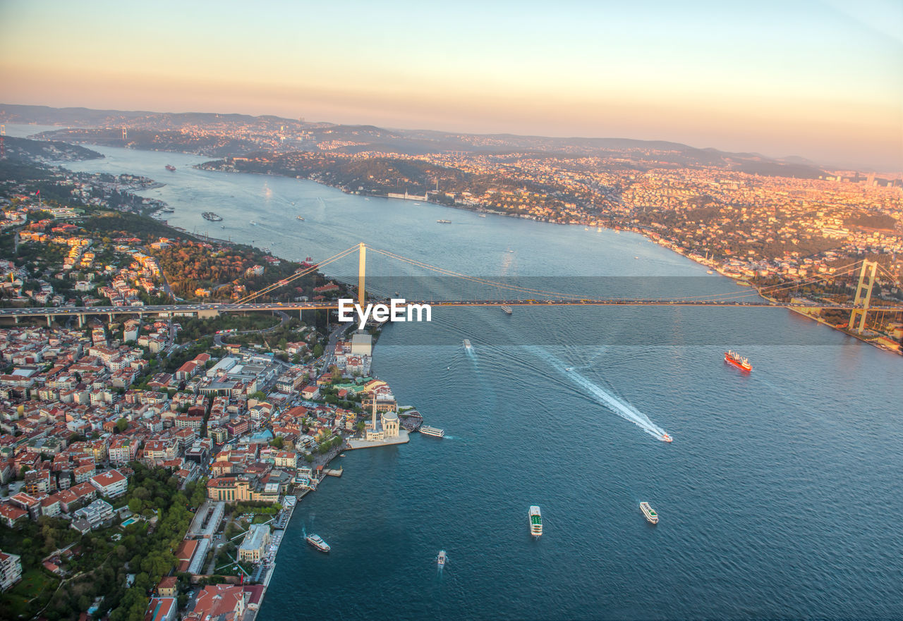 High angle view of suspension bridge over river against sky