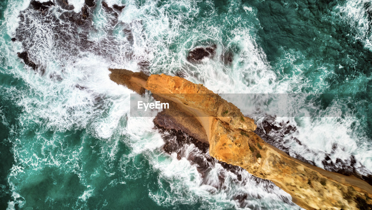 Aerial view of rock formation on sea shore