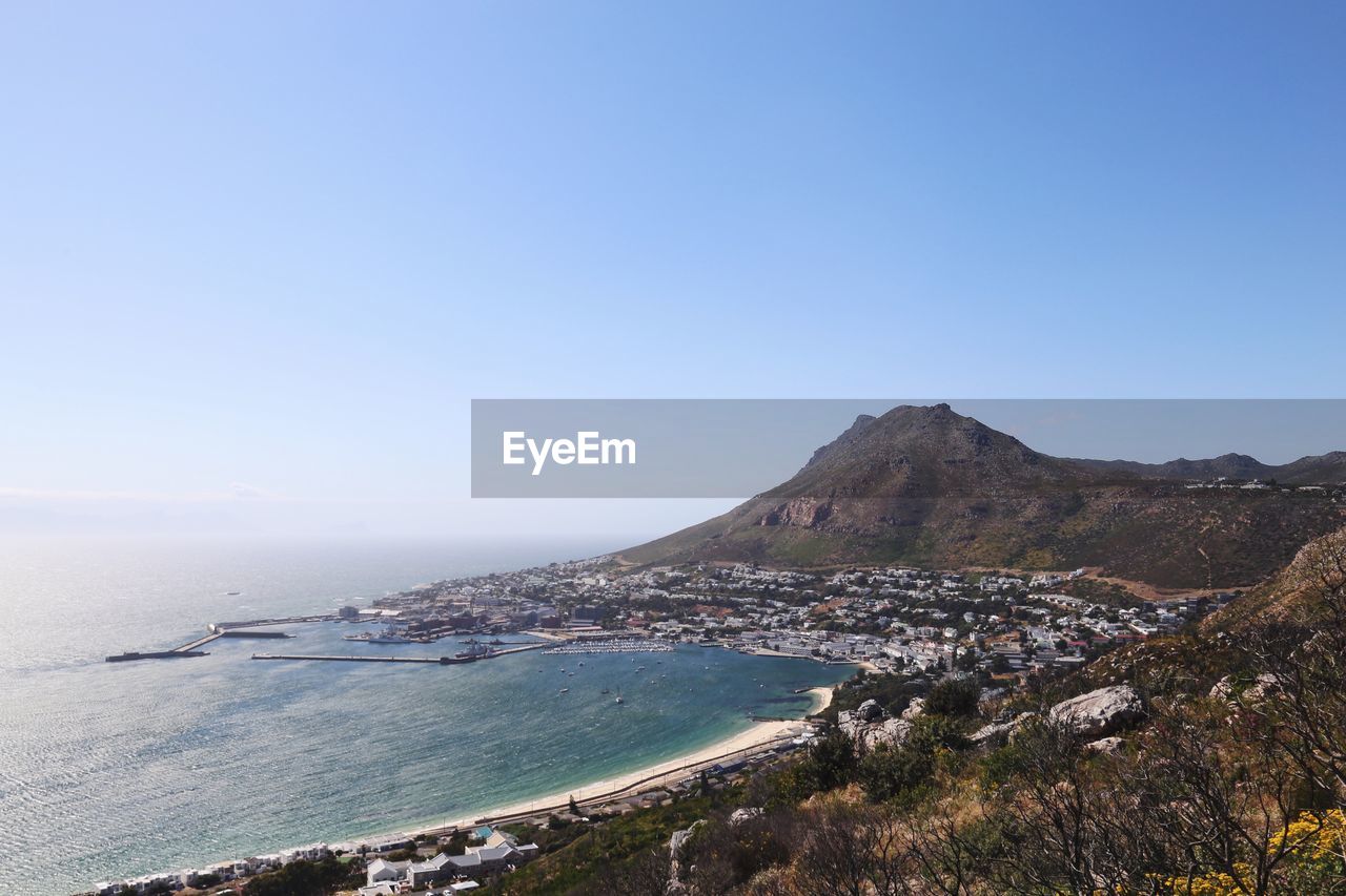 Scenic view of sea against clear blue sky