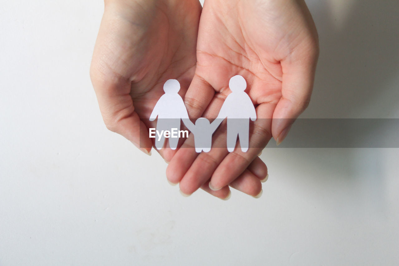 Paper cut of two men and children in family same-sex marriage