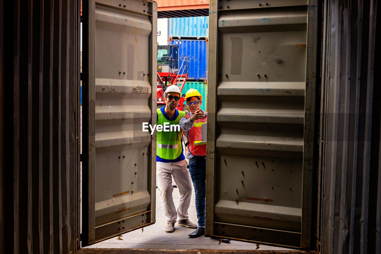 MAN WORKING IN CORRIDOR