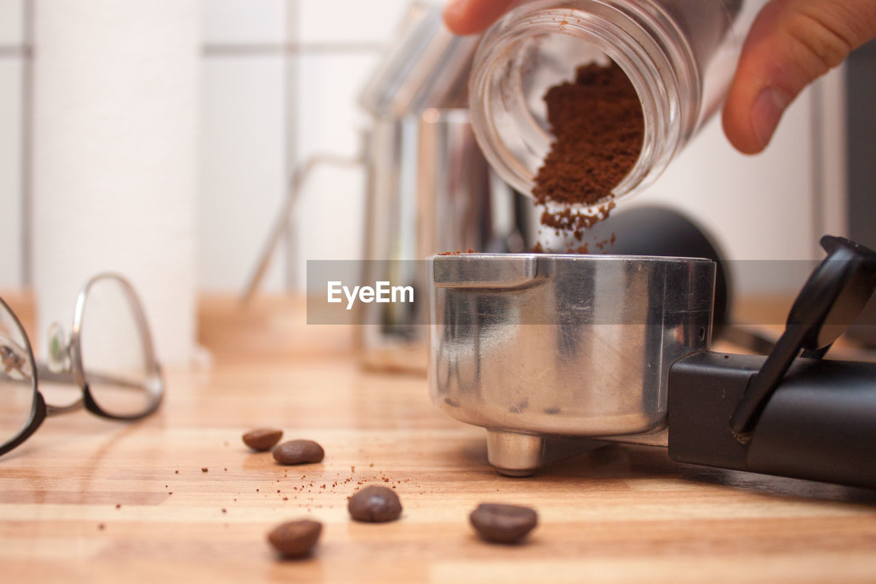 Cropped image of barista making coffee