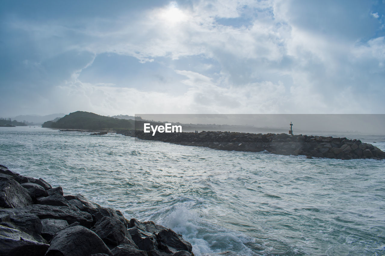sea, water, sky, beauty in nature, scenics - nature, cloud - sky, rock, motion, solid, nature, day, rock - object, no people, beach, sport, tranquility, land, outdoors, wave, power in nature, rocky coastline