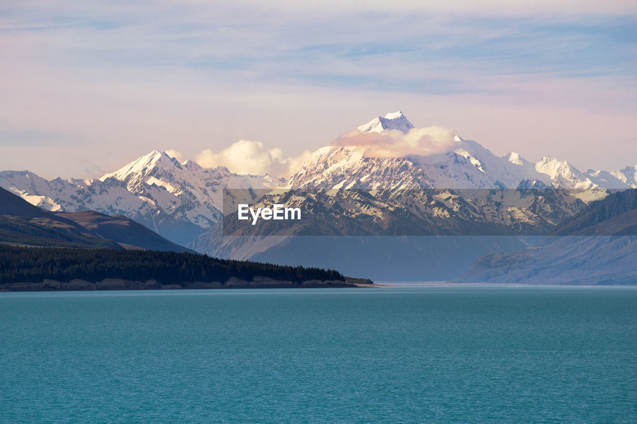Spectacular view of the famous snow-capped mt. cook across lake pukaki on a sunnny day.