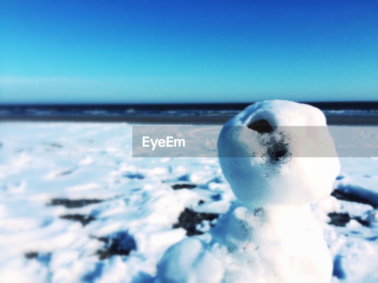 View of snow sculpture on beach in winter