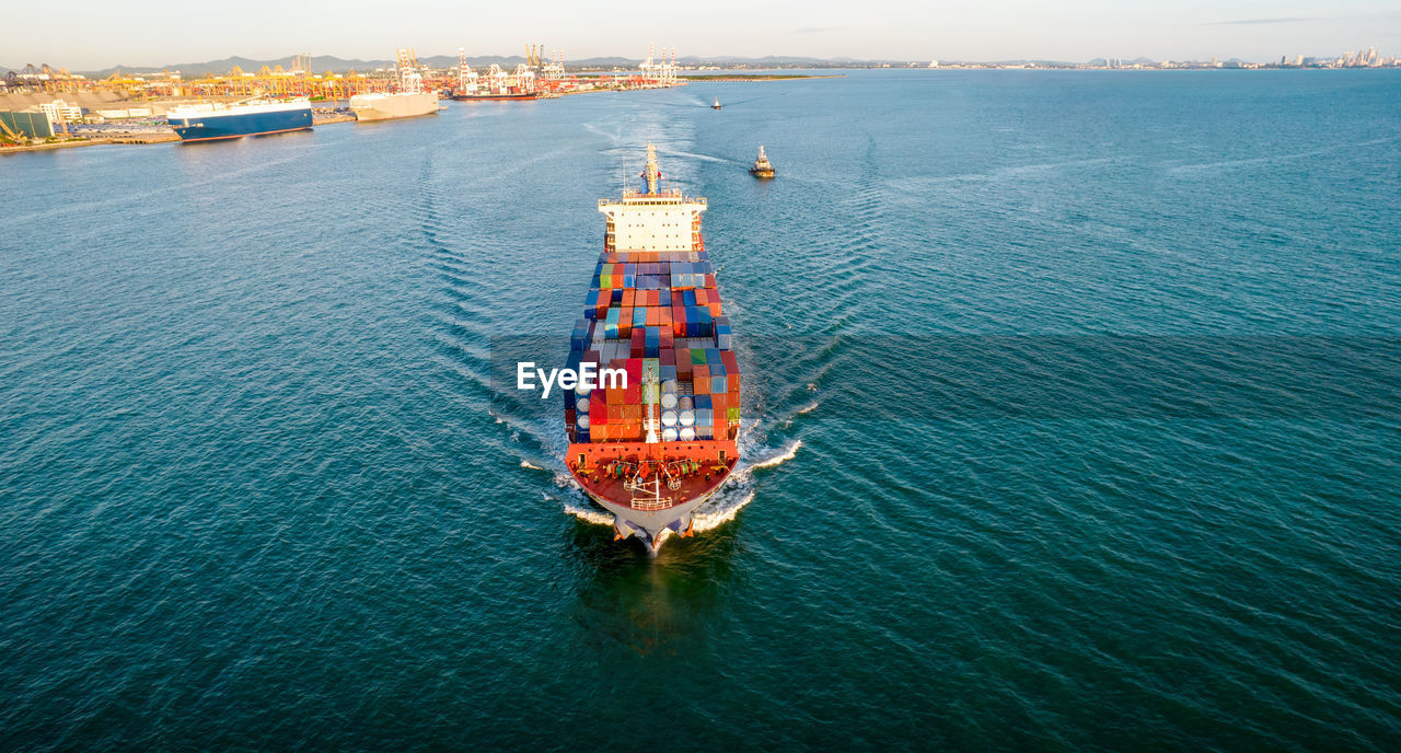 HIGH ANGLE VIEW OF SHIP AT SEA SHORE