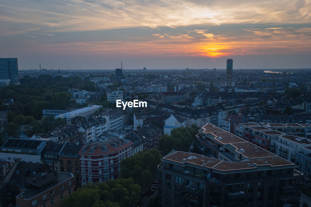 High angle view of buildings in dusseldorf, germany against sky during sunset