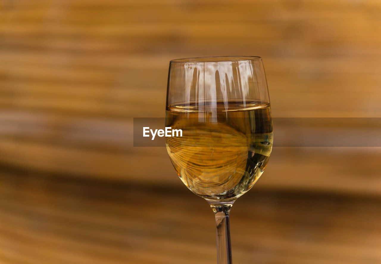 Close-up of wine in glass on table