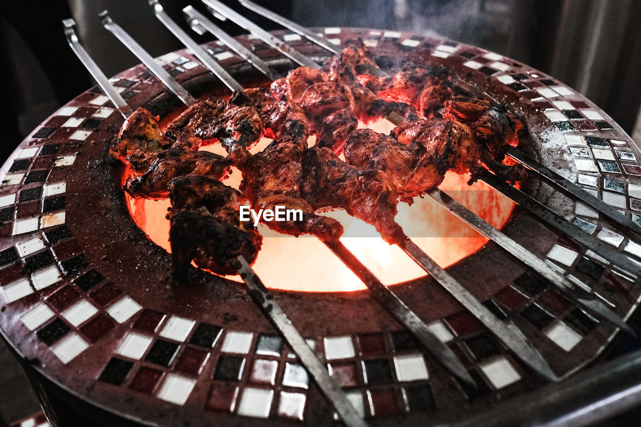 Close up view of chicken tandoori on barbecue grill