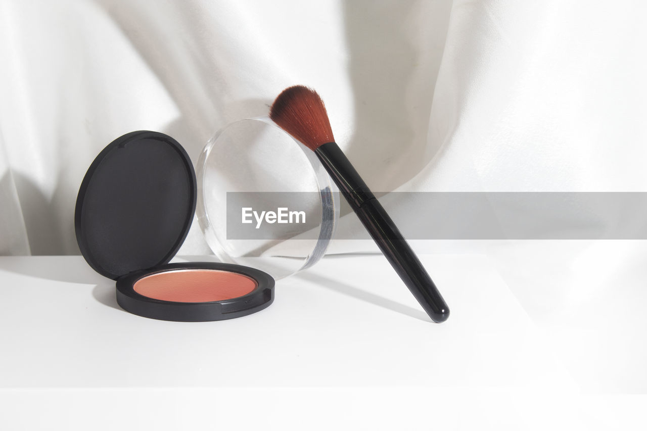 Close-up of make-up brushes on table