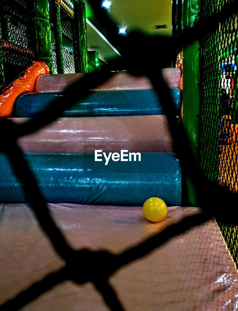 CLOSE-UP OF YELLOW BALL ON TABLE IN POOL