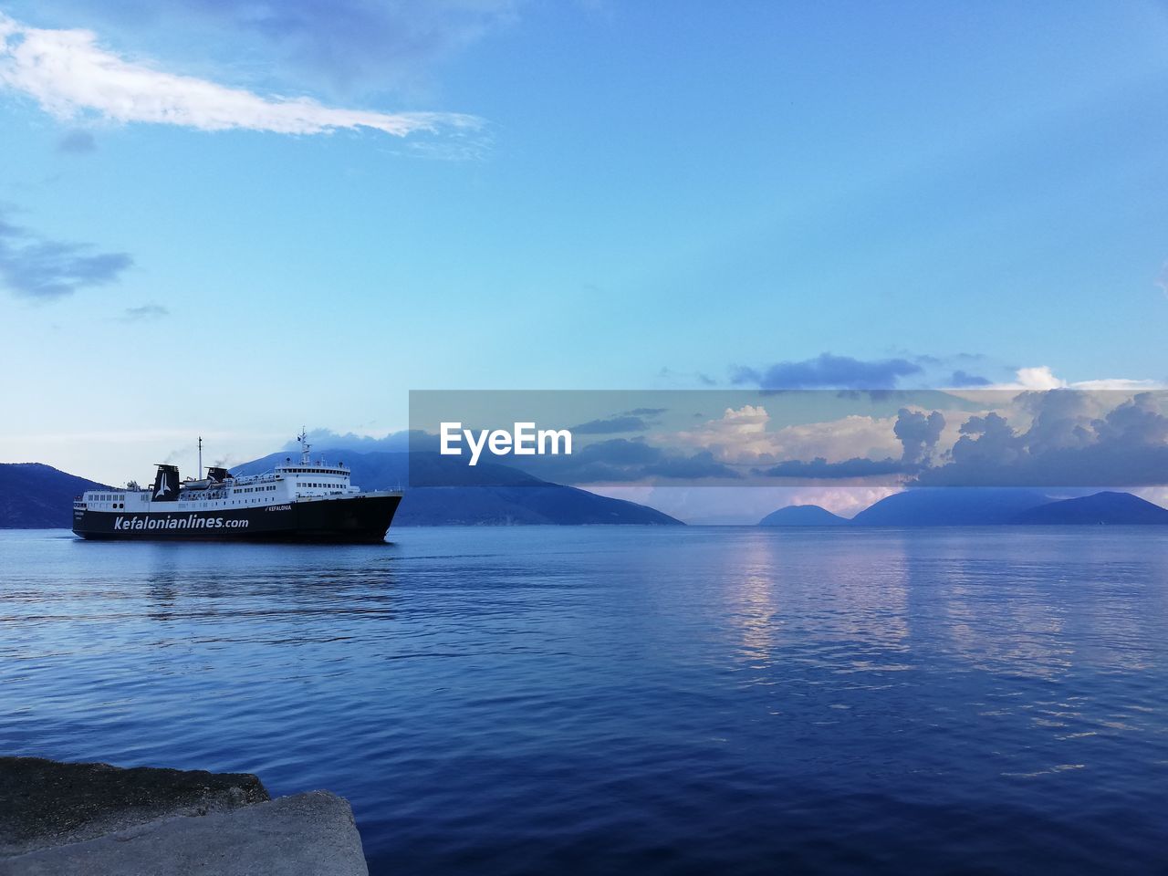 BOAT IN SEA AGAINST SKY