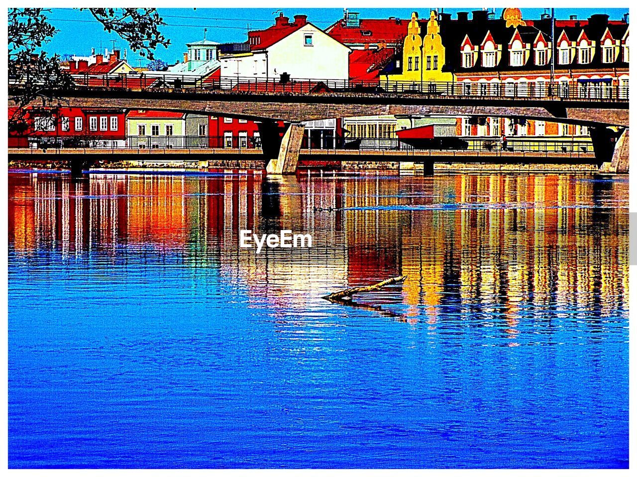 REFLECTION OF BUILDINGS IN WATER