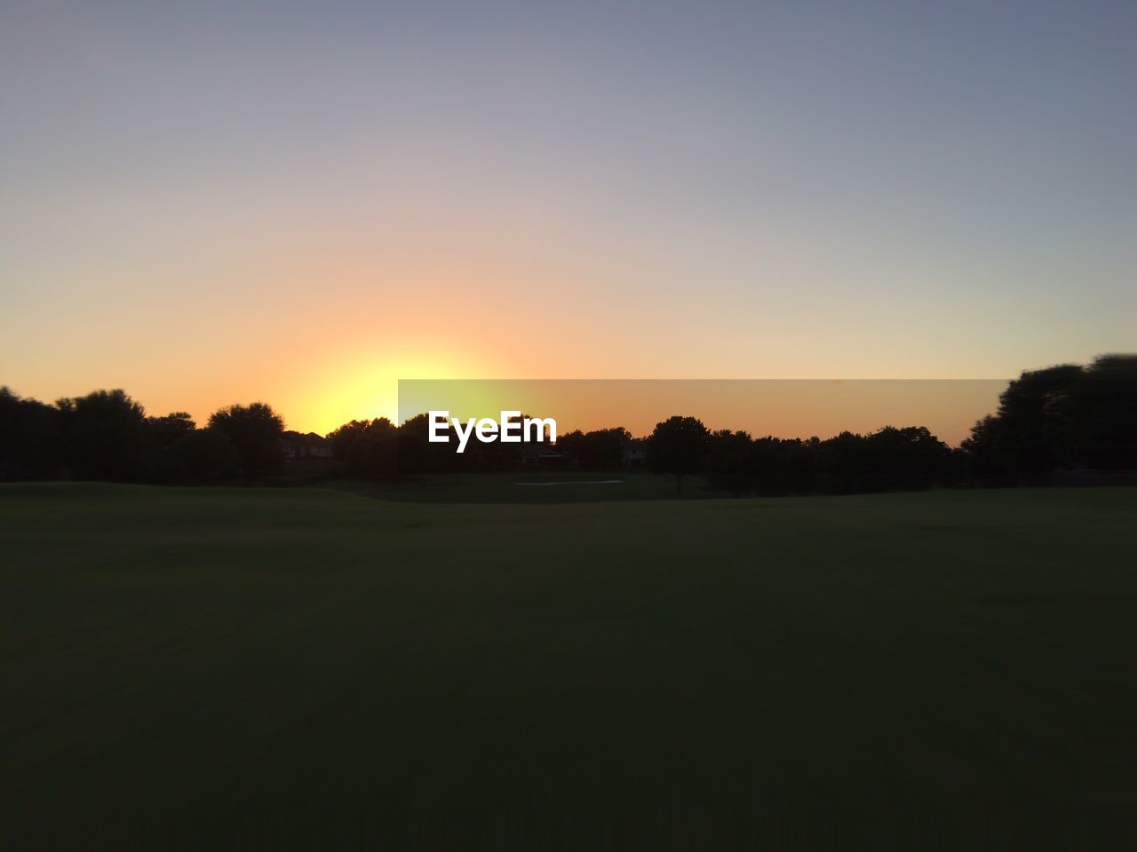 Scenic view of landscape at sunset