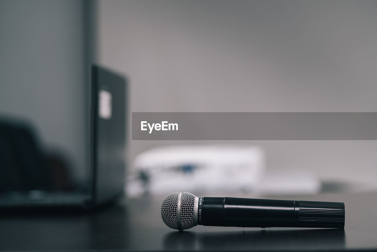 Close-up of microphone on table