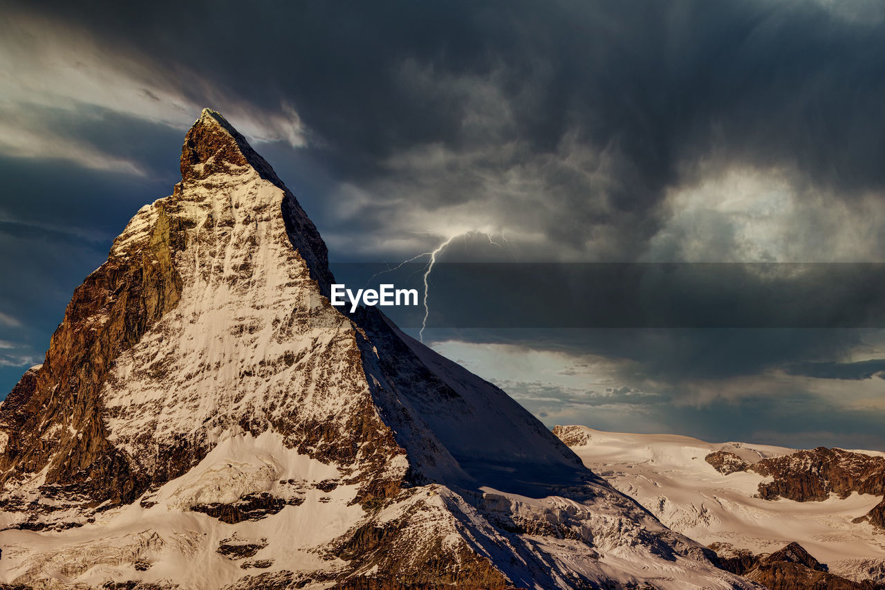 Scenic view of snowcapped mountain against sky