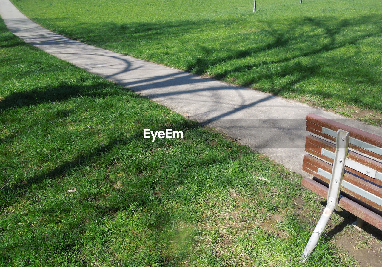 High angle view of park bench on field