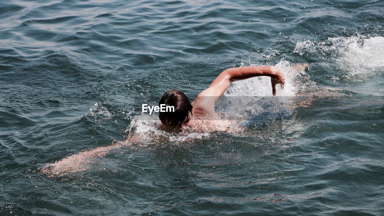 Man swimming in sea