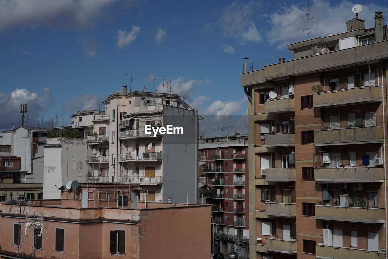 Buildings in city against sky