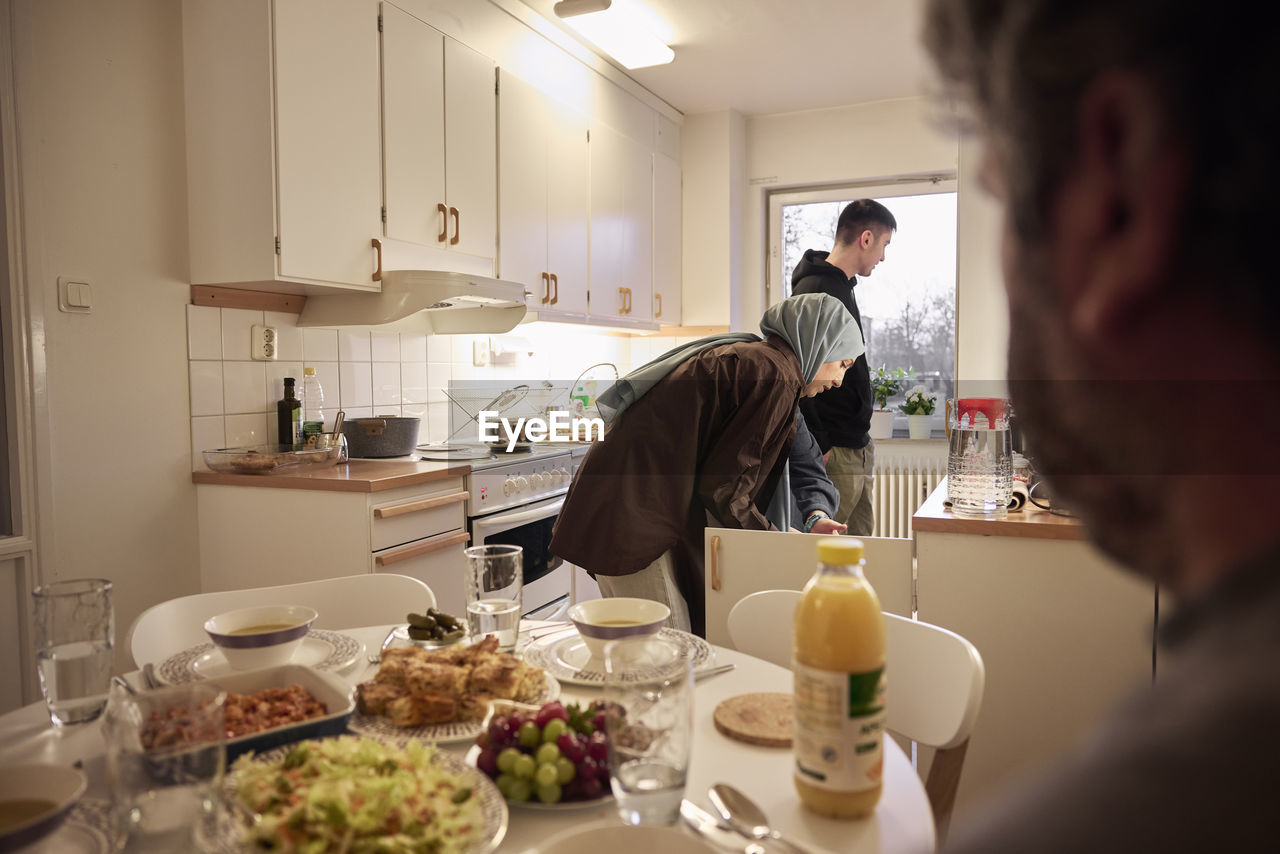 Family preparing dinner together at home