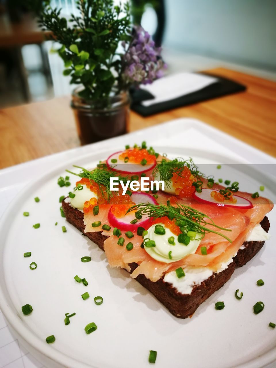 High angle view of open faced sandwich in plate on table