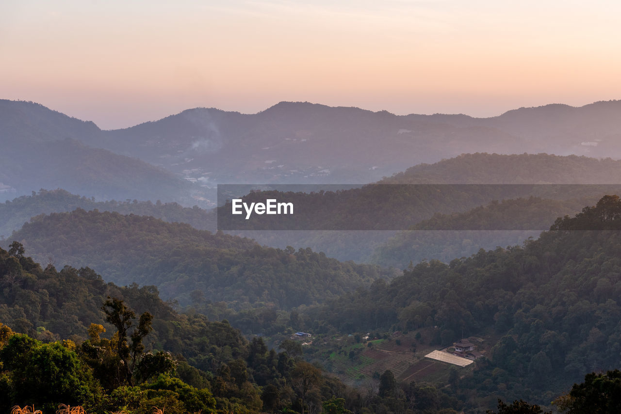 High angle view of mountains against sky during sunset