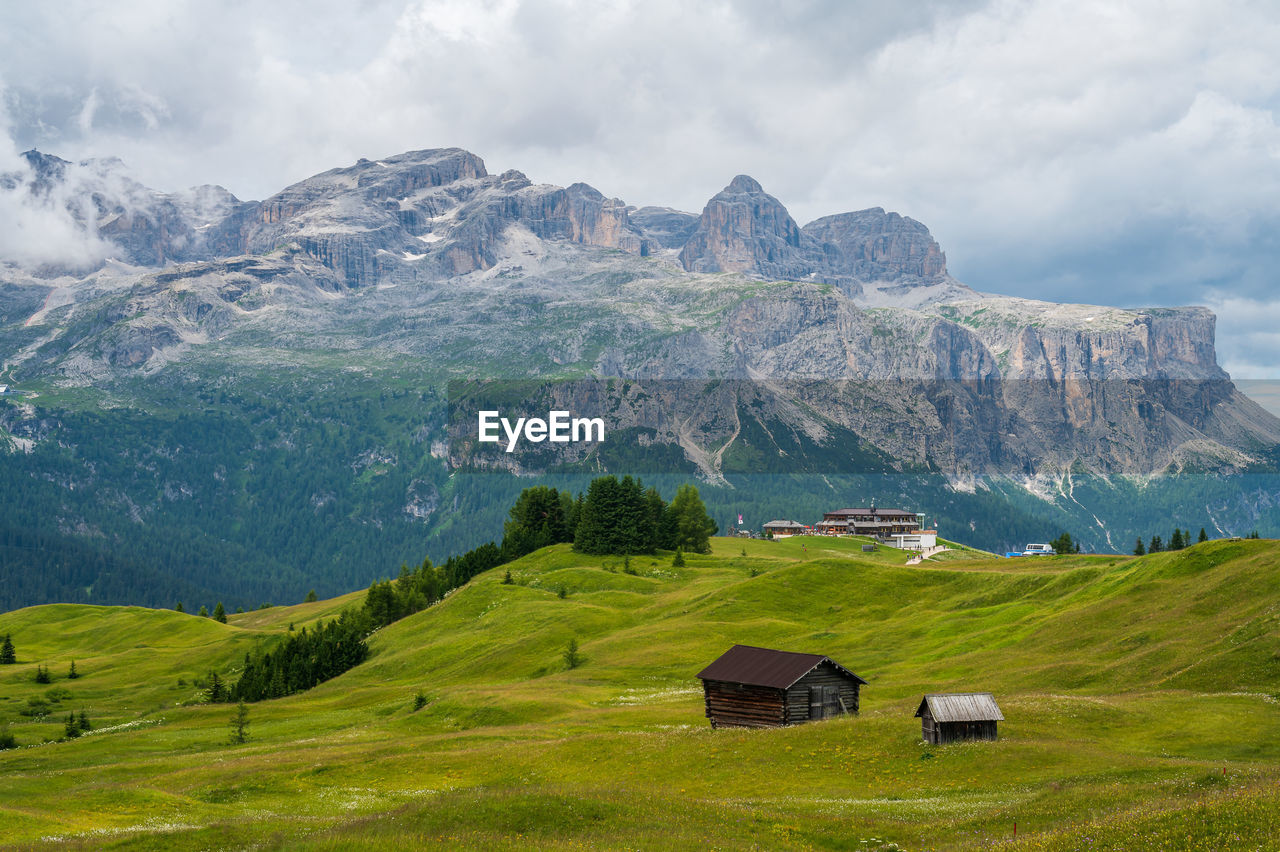 scenic view of landscape and mountains against sky