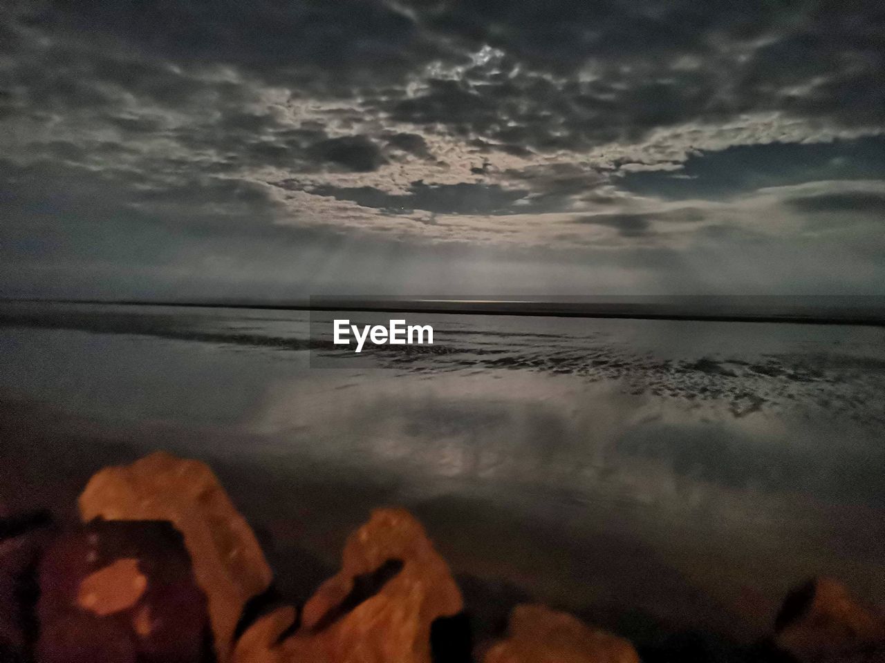 SCENIC VIEW OF BEACH DURING SUNSET