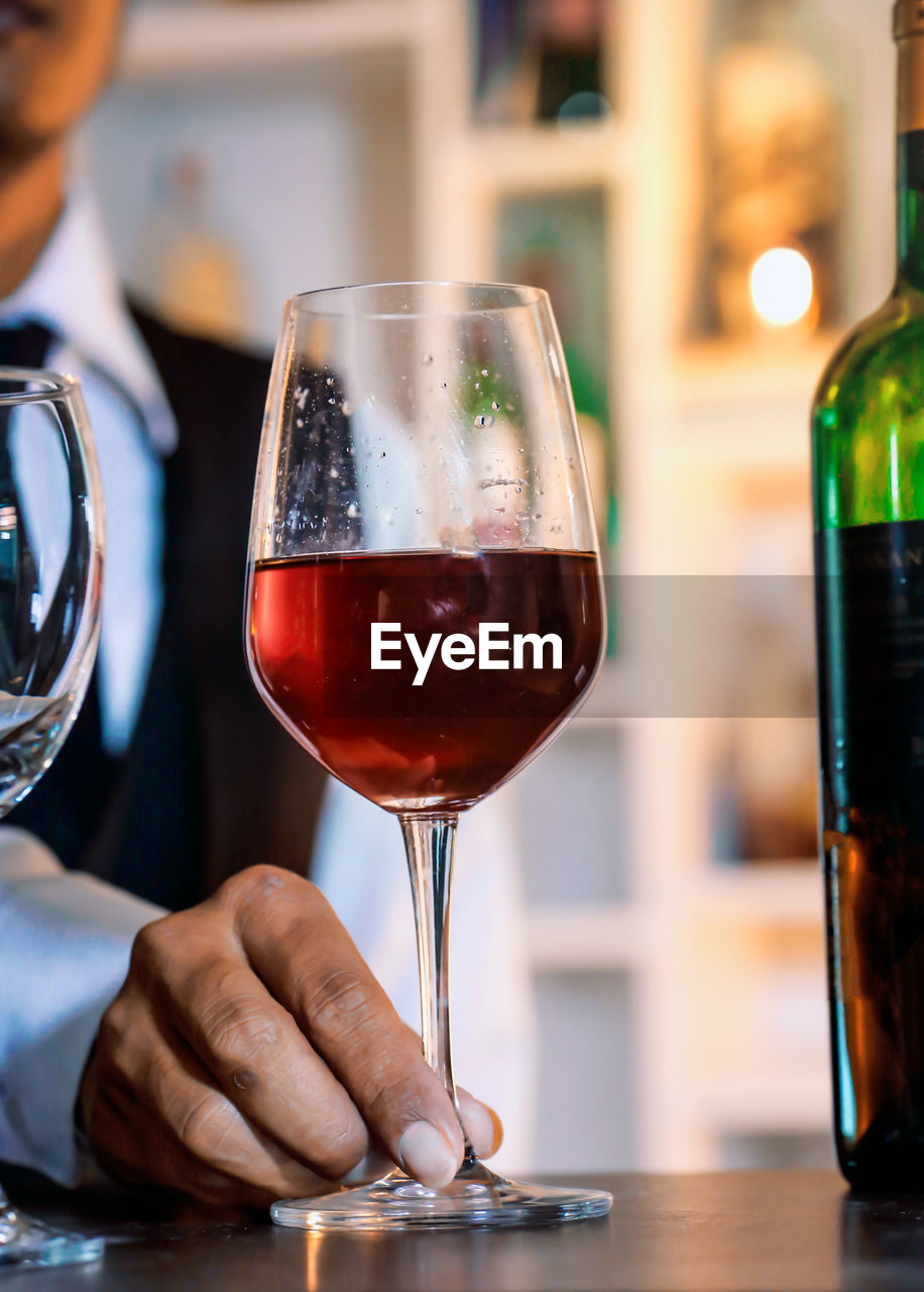 Close-up of wineglass at table