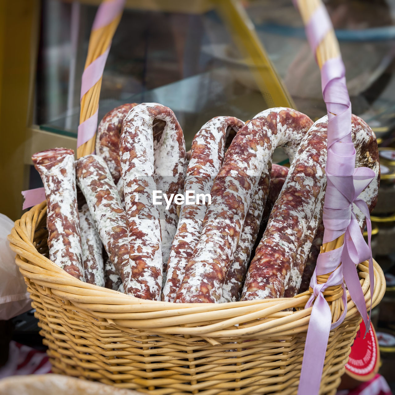 Close-up of sausages in wicker basket at market